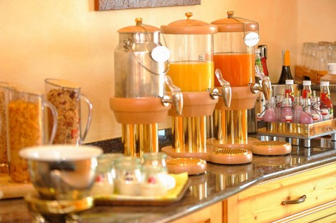 Breakfast buffet with muesli and fruit juices