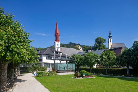 Lake promenade with pile-dwelling village pavilion and protestant church