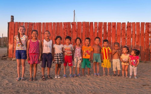 Children pose in a row