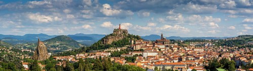 City view with statue of the Virgin Mary Notre Dame de France and cathedral