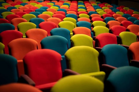 Colourful chairs in the empty auditorium