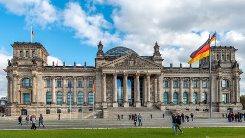 Reichstag with waving German flag