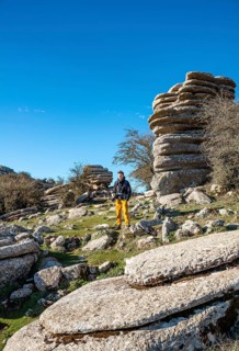 Young man standing on rocks