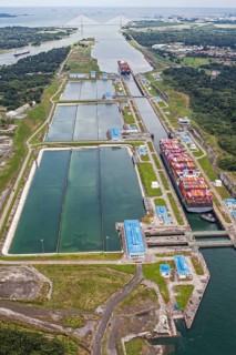 Aerial view of two Neo-Panamax container ships crossing the third set of locks at the pacific side