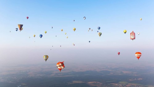 Countless hot air balloons in different colours and shapes
