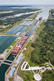 Aerial view of two Neo-Panamax container ships crossing the third set of locks at the pacific side