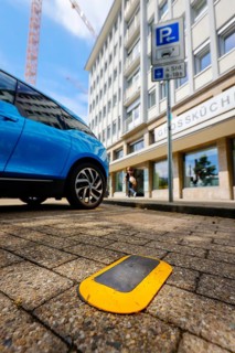 Parking space sensors show car drivers via displays of Smart Poles