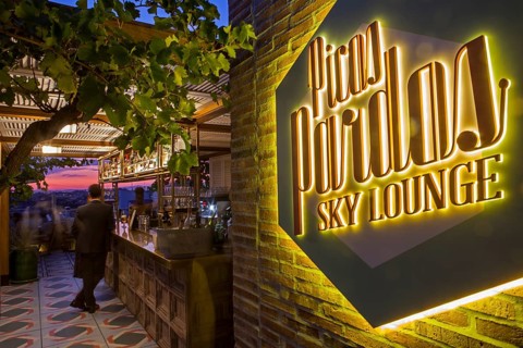 Illuminated neon sign at the corridor of the Bless hotel terrace