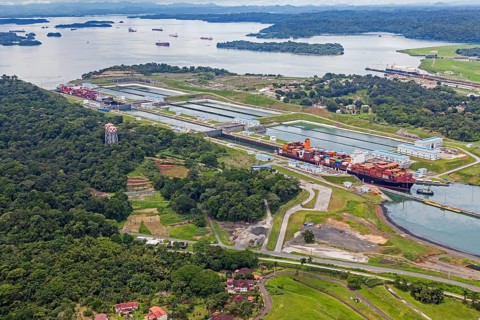 Aerial view of two Neo-Panamax container ships crossing the third set of locks at the pacific side