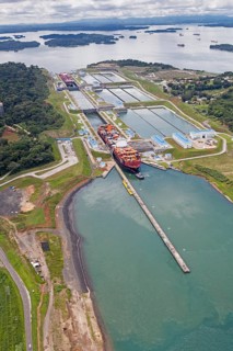 Aerial view of two Neo-Panamax container ships crossing the third set of locks at the pacific side