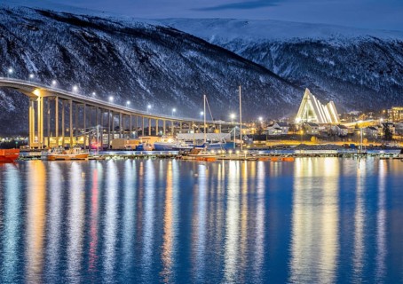 View over the harbour and city with Tromsobrua or Tromso Bridge