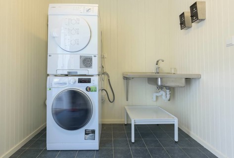 Washroom with large washing machine and dryer