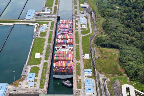 Aerial view of Neo-Panamax container ship crossing the third set of locks at the pacific side