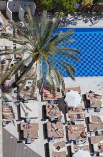 Tourists at the swimming pool in a hotel in Marbella
