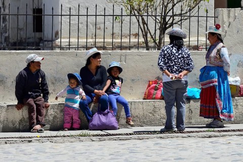 Locals chatting in front of the church