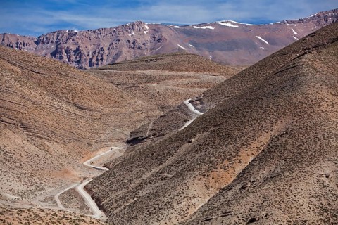 Off-road vehicle on gravel road to Mount Mgoun