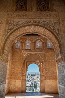 View of the Albayzin district through windows decorated with arabesques
