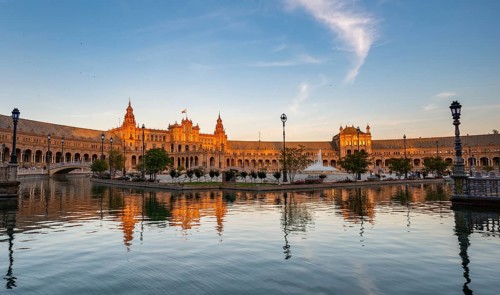 Plaza de Espana in the evening light with reflection in the canal