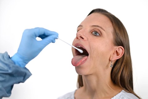 Woman receives throat swab