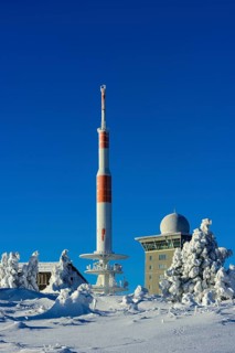 Transmitter mast and Brocken hostel on the winter snow-covered Brocken