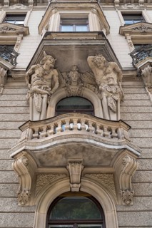 Baroque facade with balconies and 2 atlases