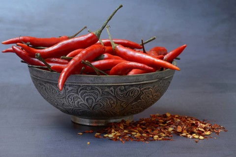 Chilli peppers in shell and chilli flakes