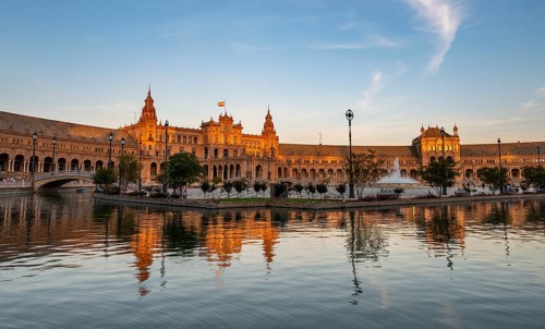 Plaza de Espana in the evening light with reflection in the canal