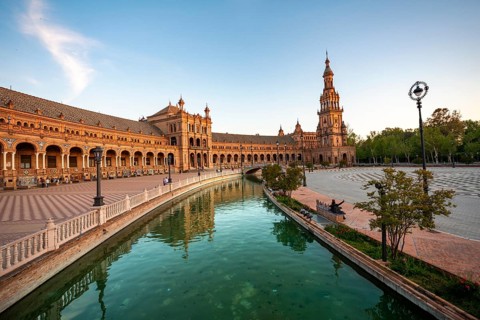 Plaza de Espana in the evening light with reflection in the canal
