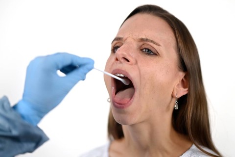 Woman receives throat swab