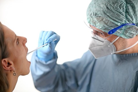 Woman receives throat swab