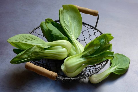 Pak Choi or Chinese mustard cabbage in wire basket