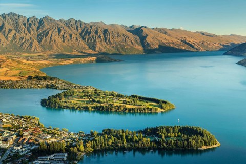 View over Queenstown and Lake Wakatipu to the Remarkables at sunset