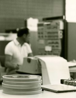 Programmer at the printer in front of the input head