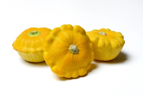 Three yellow patisson pumpkins