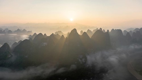 Chinese karst mountains at the Yangshuo River at sunrise