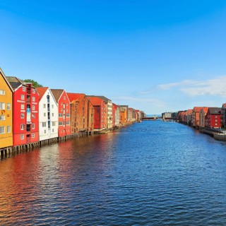 Colourful historic warehouses by the river Nidelva