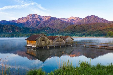 Boathouses in the Lake Kochel near Schlehdorf in the morning light