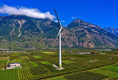 Largest wind turbine in Switzerland amidst fruit orchards in the Rhone Valley