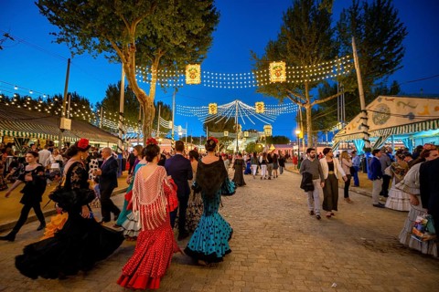 Spanish women with colorful flamenco dresses