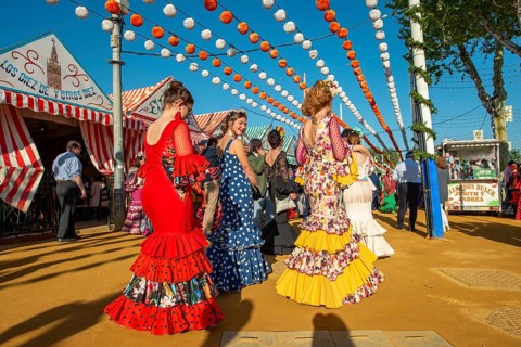 Women in colourful flamenco dresses