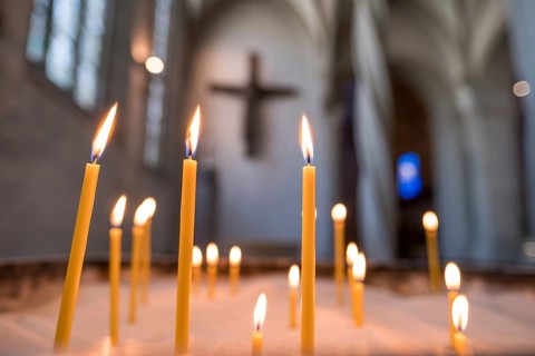 Sacrificial candles in front of the Imervard Cross