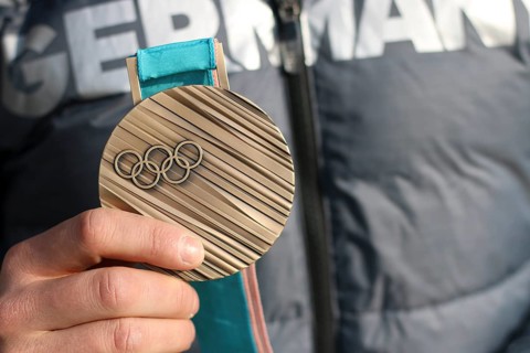 Bronze medal in the hands of an athlete