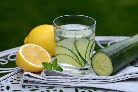 Cucumber water in glass and lemon