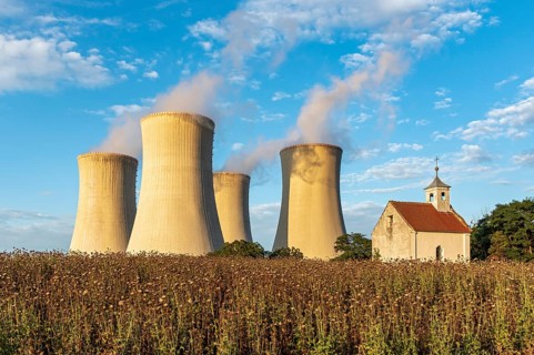 Old abandoned chapel and cooling towers of Dukovany Nuclear Power Station