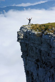 Man standing edge of the Creux du Van