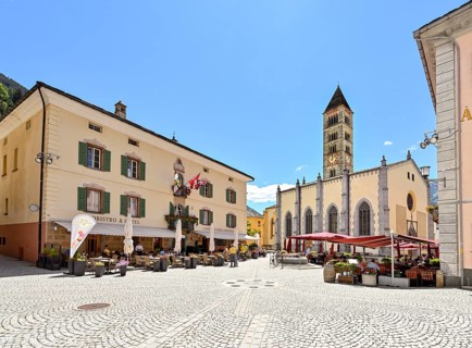 Village square with collegiate church of San Vittore Mauro