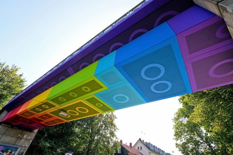 The Lego Bridge 2.0 or Rainbow Bridge is a concrete beam bridge over Dahler Strasse in Wuppertal-Langerfeld. Developed by graffiti and streetart artist Martin Heuwold