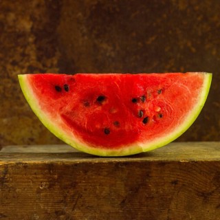Close-up of watermelon Slice on a brown background