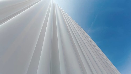 Modern white facade of corrugated acrylic glass