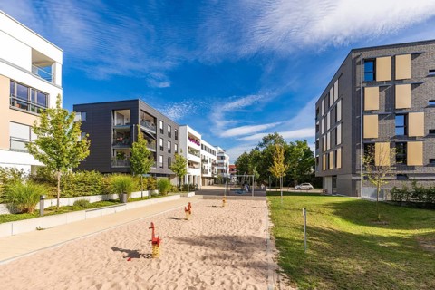 Playground in front of modern apartment building
